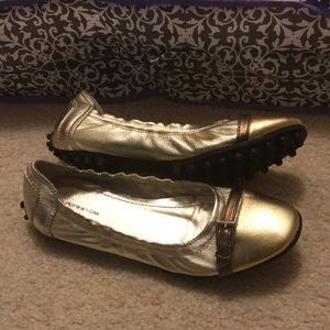 Gold buckle flats with flexible driving sole